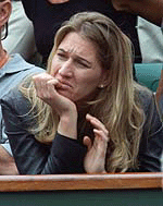 Former German tennis star Steffi Graf grimaces during a French Open quarterfinal match between Sebastien Grosjean of France and Andre Agassi of the USA at Roland Garros on Wednesday.
