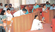 A Congress councillor, Ms Kamlesh, sits on dharna inside the MC House in Chandigarh on Friday. 
