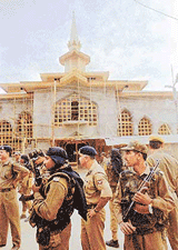 Police personnel keep a strict vigil around the shrine of Sheikh Noor-ud-din Noorani at Charar-e-Sharief on Saturday. 
