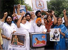 Activist of national akali dal protesting against the rising depiction of obscenity and violence in the T.V. programmes broadcast by the satellite channels in New Delhi on Sunday.