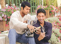 Indias Mahesh Bhupathi (right) and Leander Paes drink champagne after winning the mens doubles title in the French Open at the Roland Garros Stadium on Saturday in Paris. 