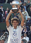 Gustavo Kuerten of Brazil holds up the trophy he won after defeating Alex Corretja of Spain in the men's final at the French tennis open at Roland Garros stadium on Sunday. 