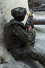 A soldier outside a Mosque.