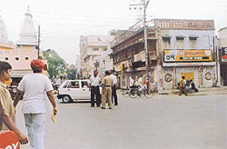 Policemen regulate traffic at Mata Rani Chowk.