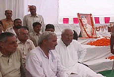 Mr Om Prakash Chautala (R) with the family of martyr Rajinder Singh Ahlawat at a ceremony in Kharkhara village, near Meham, on Wednesday.