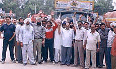 Local truck operators blocking a truck from outside the state in Ambala on Saturday.