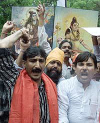Activists from the Shiv Sena Party shout anti-government slogans during a protest near the Indian parliament in New Delhi, on Saturday. 