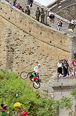 Chinese daredevil Wu Shunye leaps a section of the Great Wall near Beijing sitting backwards on his motorcycle to promote the Chinese capital's bid to host the 2008 Olympics, on Saturday. 