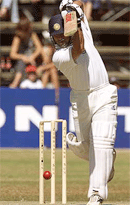 Indian batsman Sachin Tendulkar drives a delivery against Zimbabwe on Sunday.