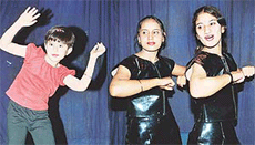 (From L), Christieve and Richa Sareen take part in a dance competition at Tagore Theatre on Sunday.