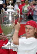 Australia's Lleyton Hewitt holds the Queens Club trophy after defeating Britain's Tim Henman in the final at Queen's Club in London on Sunday. Hewitt won 7-6, 7-6. 