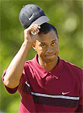 Tiger Woods tips his cap on the 18th green to the gallery after his fourth round of the U.S. Open at Southern Hills Country Club in Tulsa, Okla., on Sunday