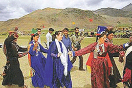 The Jammu and Kashmir Minister of State for Tourism, Miss Sakina Ittoo (centre), joins a group of local folk dancers at the inaugural function of the 15-day-long Kargil festival at Goshan Grounds in the foot-hills of Tololing and Tiger hills at Dras. 