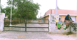 Visitors to the Civil Hospital have to jump over the wall of the hospital as the gate has been closed "permanently" with the help of an iron chain by hospital authorities.