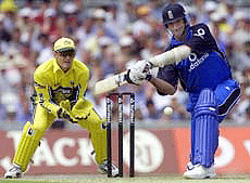 England batsman Andy Caddick plays a stroke as Australia's wicketkeeper Adam Gilchrist looks on Thursday, during their one-day international match at the Oval.