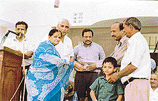Mr M.M. Vyas and his wife hand over the keys of an MIG flat to a allottee in Shaheed Bhagat Singh Nagar in Ludhiana on Thursday.
