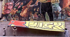 Activists of Ali Sena Tearing off the Banner of Film "Gadar" at a theatre in New Delhi on Sunday. 