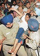 Neeraj Kumar Aggarwal is taken away by the Chandigarh police to the General Hospital on the fifth day of his fast in Sector 17, Chandigarh, on Sunday night.