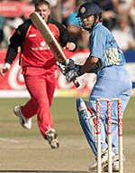 Indian opening batsman Sachin Tendulkar watches his shot off Zimbabwe bowler Heath Streak in Harare on Sunday.
