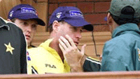 Australias Michael Bevan holds his face after being hit by a beer can thrown from the crowd at Lords cricket ground on Saturday. 