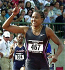 Sprinter Marion Jones gestures to the crowd after winning her 200-metre semifinal during the USA Track and Field Championships on Saturday in Eugene, Ore.