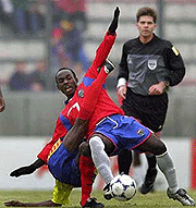 Ecuador's Jorge Guagua (on ground) tries to stop Costa Rica's Johel Fajardo, during their Sunday World Cup U-20 soccer game in Salta, Argentina.