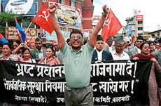 Hundreds of supporters and lawmakers of the main Opposition United Marxist Leninist Communist Party of Nepal march through the streets of Kathmandu on Monday.