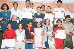 Winners of the painting competition organised by the UT police on the occasion of International Day Against Drug Abuse, show their prizes after the prize distribution function at the Sector 17 Plazza in Chandigarh on Tuesday. 