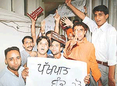 Students outside the office of the DSW, Panjab University, on Tuesday.