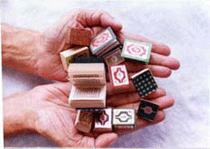 A collector in kolkata holds his collection of miniature Korans in his palm.