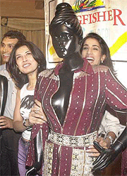 Famous Indian fashion designer Ritu Beri along with former Miss India Manpreet Brar presenting her products from India that participate the forthcoming Haute Couture week in Paris, at a Press conference in New Delhi on Wednesday. 