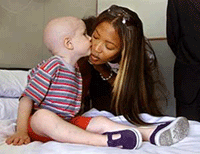British supermodel Naomi Campbell kisses young Raul Pallases during her visit to Sant Pau hospital in central Barcelona on Wednesday. 