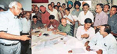 Mr Ashwini Luthra, Commissioner of Income Tax, Chandigarh (extreme left) inspects the income tax camp organised by The Tribune Employees Union, Chandigarh, in The Tribune premises on Wednesday. 