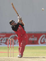 Zimbabwe captain Guy Whittall strikes out for a four against India on Wednesday.