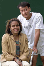 Australian athlete Kathy Freeman and U.S. tennis player Michael Chang pose for pictures at the Wimbledon Tennis Championships on Wednesday.