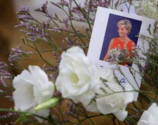 A picture of Diana, Princess of Wales, on flowers at her family home at Althorp, near Northampton, on Thursday. 