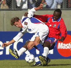 Costa Rica's Erick Scott, right, battles for the ball with Czech Republic's Radek Sirl.