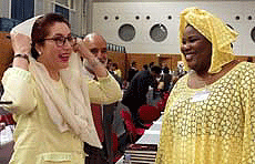Pakistan Peoples Party leader Benazir Bhutto (left) talks with Senegalese Socialist International Vice-President Aminata Ndiaye at a meeting in Lisbon on Friday. 