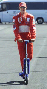 Germany's Ferrari world championship overall leader Michael Schumacher rides his scooter before a free practice session ahead of the French Grand Prix in Magny-Cours on Friday.