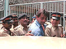 Film actor Sanjay Dutt who accused in the serial bomb blast case, coming out of TADA court after the end of the trial in Mumbai on Friday where he denied all the charges against him.