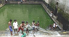 The 700-year old Baoli (water-tank ) at the shrine of Hazrat Nizamuddin Aulia being cleaned after years in preparations for the July 14 visit of Pakistani President Gen Pervez Musharraf.