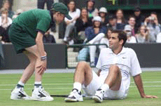 Pete Sampras of the U.S. talks to a ballboy after falling during his match against Sargis Sargsian of Armenia.