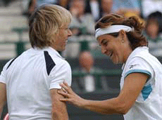 Martina Natratilova, left, and Arantxa Sanchez Vicario, share a light moment during their womens' doubles match against Giulia Casoni and Sandra Nacuk on the Number One Court at Wimbledon on Thursday.