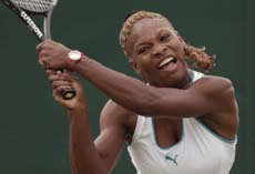 Serena Williams of the U.S. returns serve to Switzerland's Emmanuelle Gagliardi during their third round match at Wimbledon.
