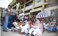 Students of Himachal Pradesh University (HPU) stage a dharna outside the venue of a meeting of the executive council on Saturday.