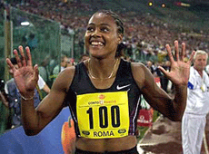 USA's Marion Jones celebrates after winning the 100m dash during the Golden Gala athletics meeting at Rome's Olympic stadium, on Friday. 