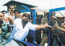 Supporters of M. Karunanidhi, former Chief Minister of Tamil Nadu, demonstrate against his arrest in Chennai on Saturday. 