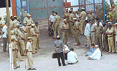 Former Tamil Nadu Chief Minister M. Karunanidhi squatting outside the Central Prison where he has been lodged after his arrest in the wee hours on Saturday.