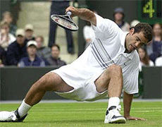 Defending champion Pete Sampras falls during his men's singles, third round match against Armenia's Sargis Sargsian , at Wimbledon on Friday. Sampras went on to win the match 6-4, 6-4, 7-5.