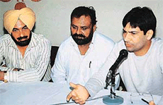 Punjabi singer Jasbir Jassi addresses newspersons at the Chandigarh Press Club on Saturday while Mohamad Sadiq and Pammi Bai look on.